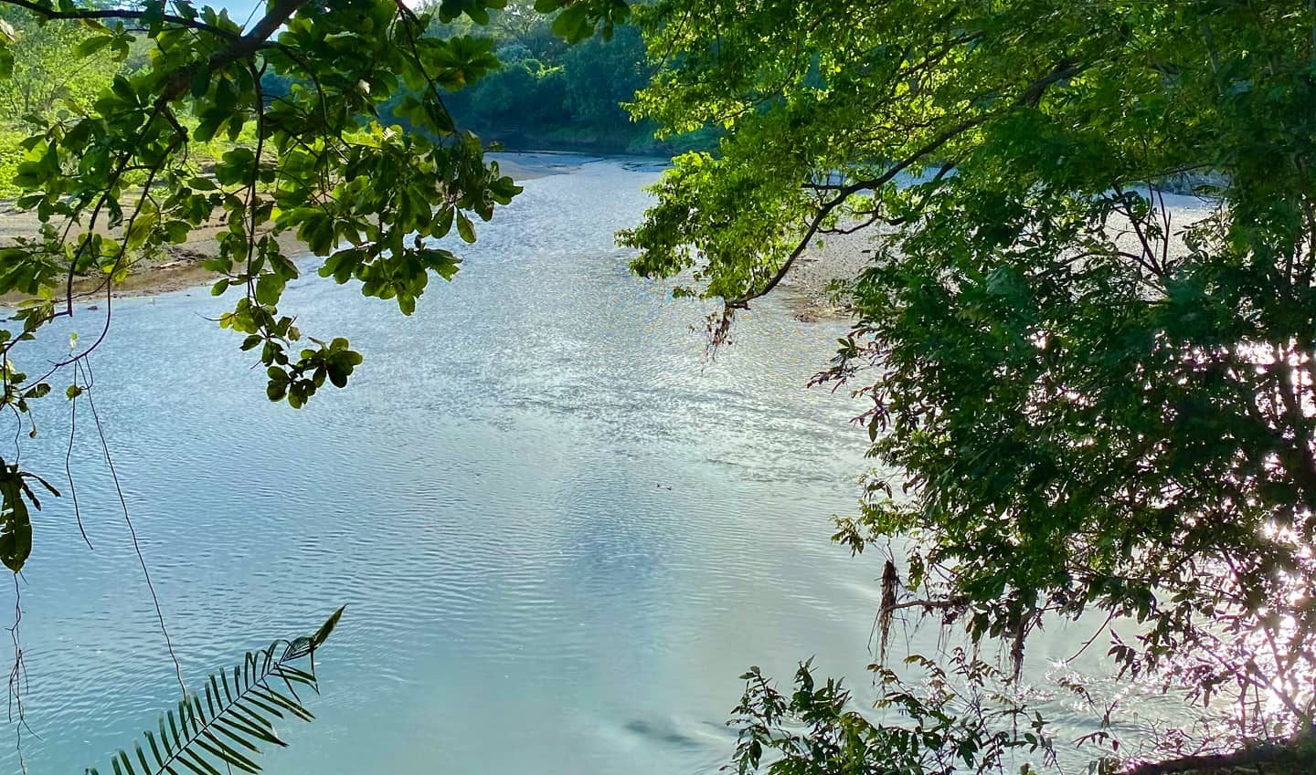 The Nosara River along the southern boundary