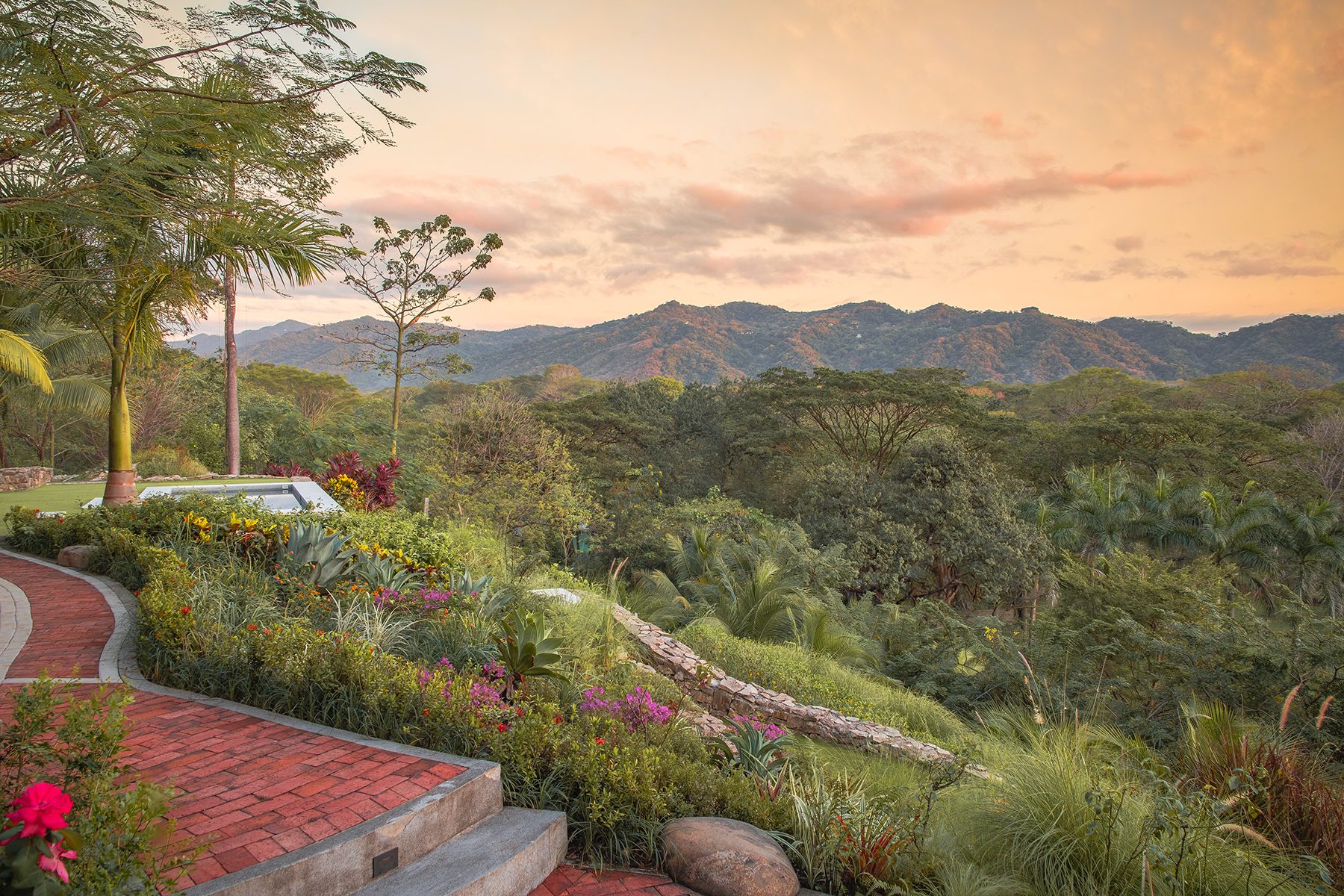 The estate grounds below misty mountains, Nosara, Costa Rica