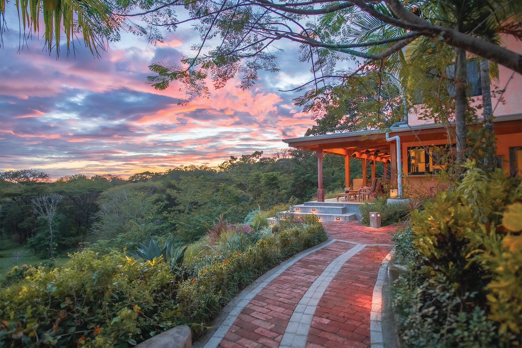 The garden path to the residence at sunset