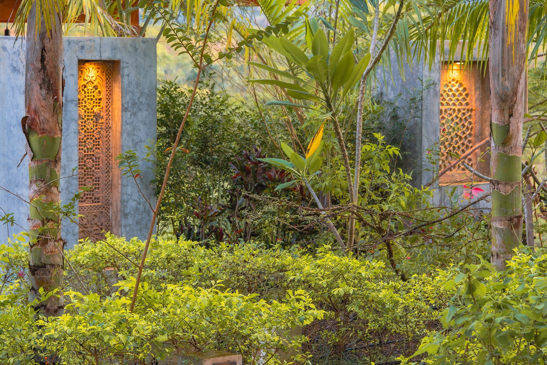 Carved stone jali windows lit at dusk