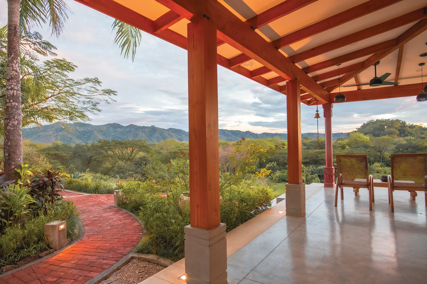 Covered terrace brick walkway — The Sanctuary Estate, Nosara, Costa Rica