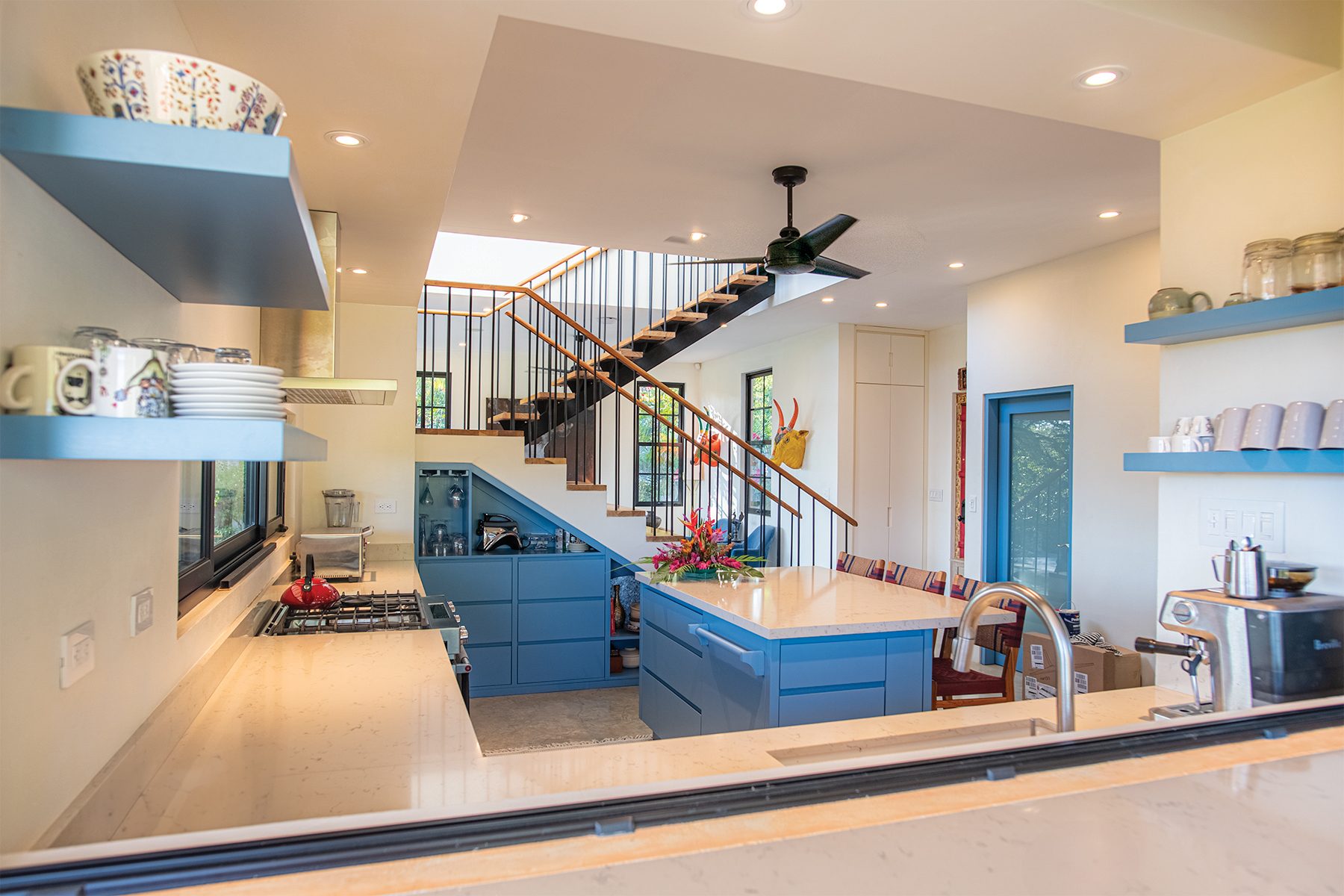 Kitchen and floating staircase — The Sanctuary Estate, Nosara, Costa Rica