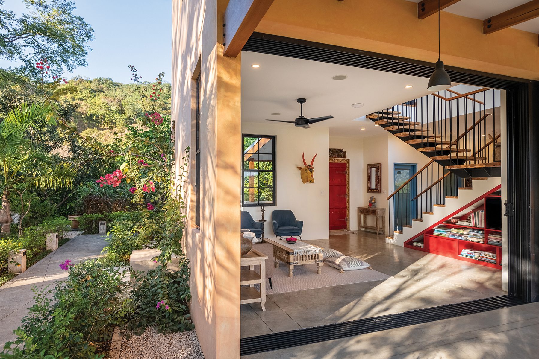 Open living room from garden — The Sanctuary Estate, Nosara, Costa Rica