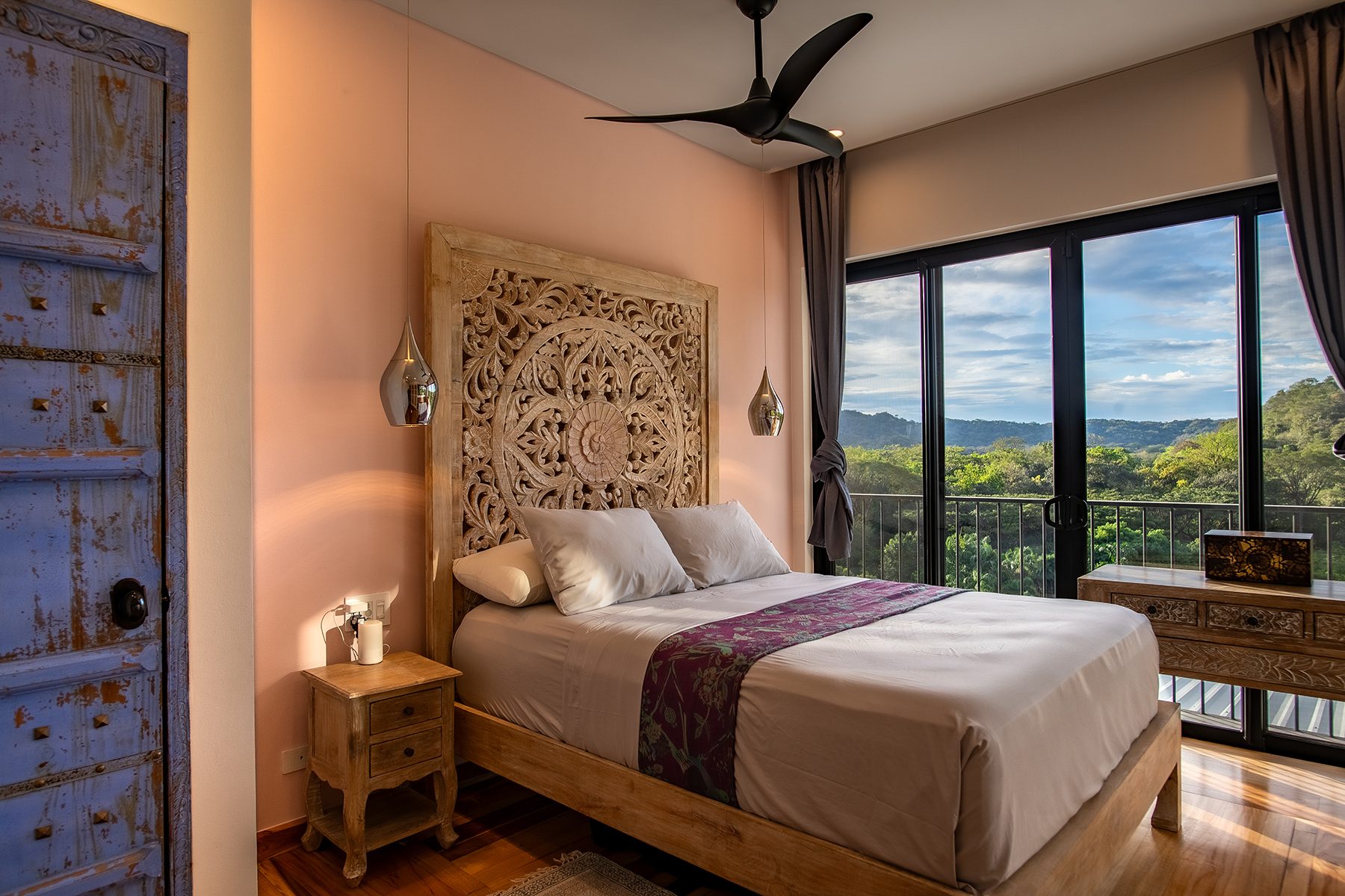 Peach bedroom balcony view — The Sanctuary Estate, Nosara, Costa Rica