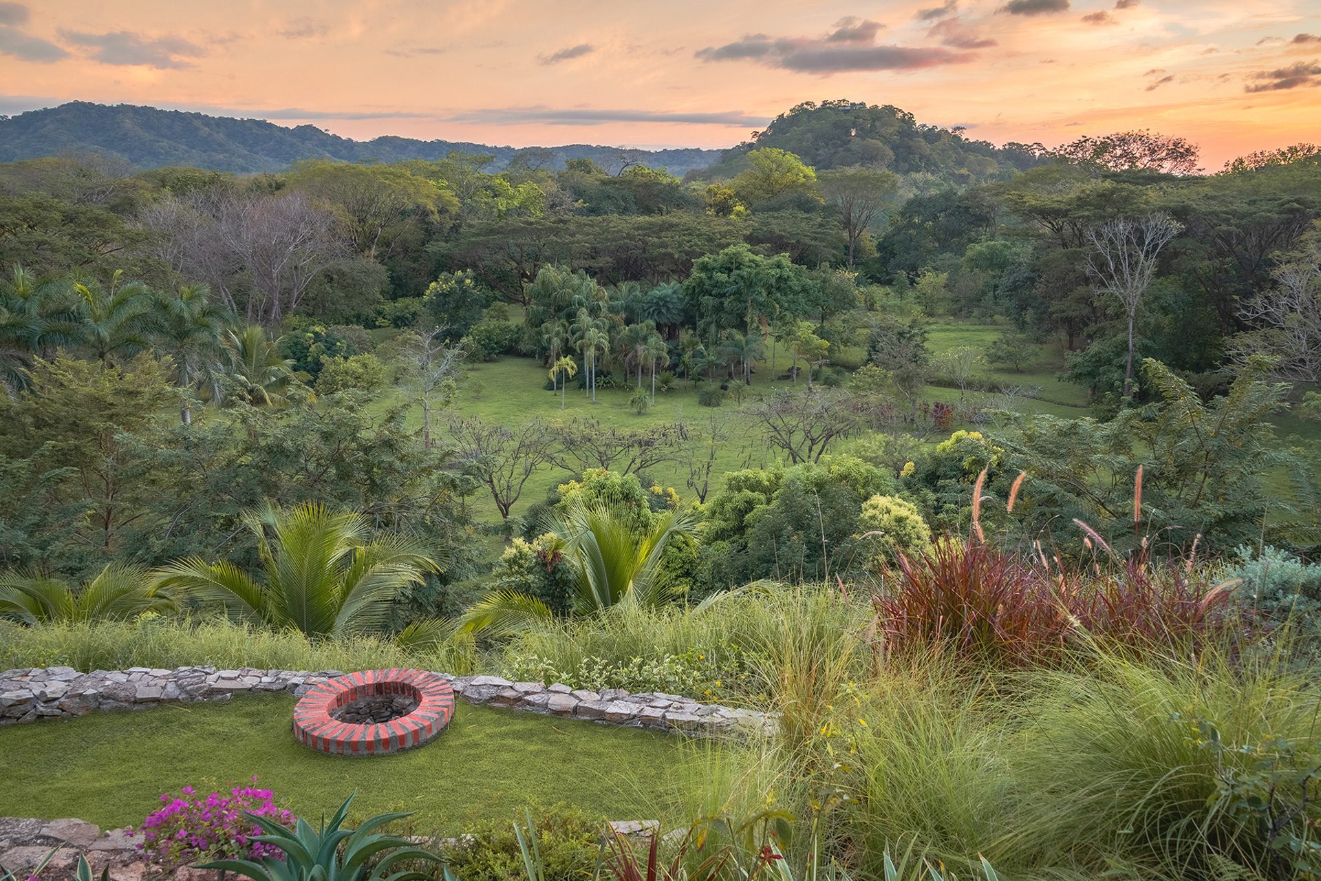 Garden fire pit sunset view — The Sanctuary Estate, Nosara, Costa Rica